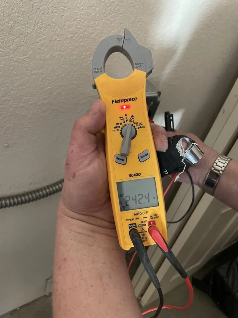 Voltage testing with clamp meter during Circuit Breaker Repair in Manchester